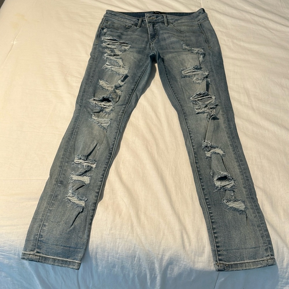 Bebe super distressed skinny jeans
